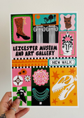 A hand holds a colorful illustrated poster for Leicester Museum and Art Gallery, New Walk, featuring a grid of whimsical drawings in pink, yellow, green, black, and white against a plain light background.